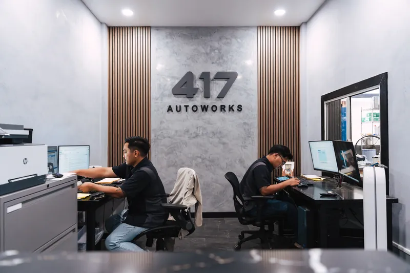 417 Autoworks estimators reviewing repairs at their desks