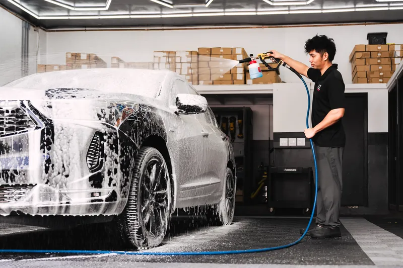 Applying a snow-foam bath before paint correction