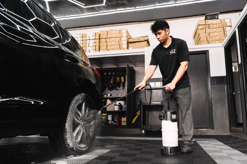 Pressure-washing a vehicle in the wash bay
