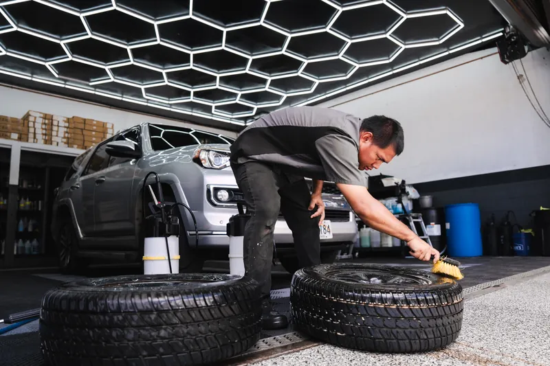 Cleaning and dressing the tires during final detail