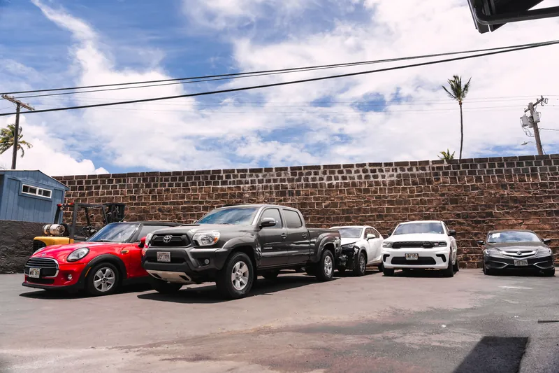 Customer vehicles parked at the 417 Autoworks lot in Wailuku