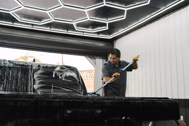 Washing out a truck bed during detailing