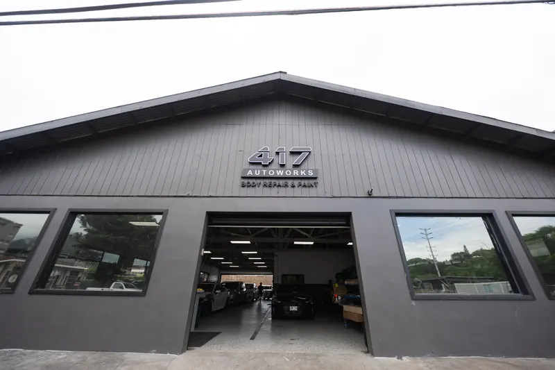 The 417 Autoworks building with open shop bays in Wailuku